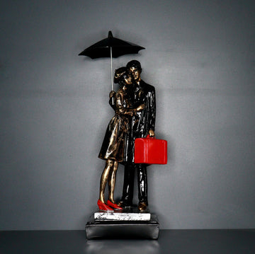 Polyresin Couple Under Umbrella with Suitcase Showpiece